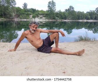 Mature Man On River Beach