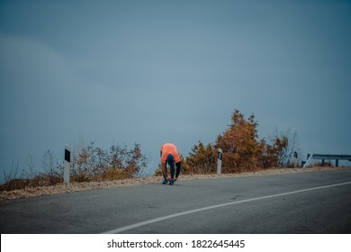 Mature Man Over 40 Wearing Sport Clothes Tying His Training Shoes