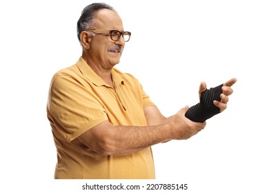 Mature Man In Pain Wearing An Elastic Wrist Band Isolated On White Background