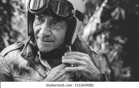 Mature Man Putting On A Helmet