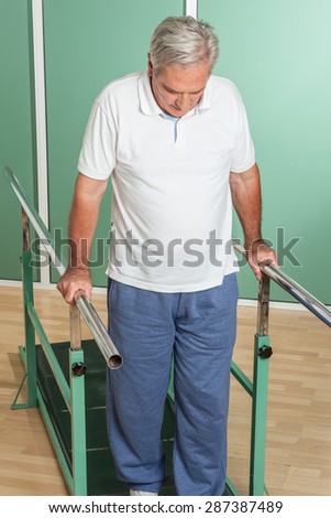Mature man rehabilitating his legs