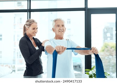 Mature, man and resistance band with woman or physiotherapist for physical therapy, mobility exercise and arthritis management. Geriatric physiotherapy, stretching arm and rehabilitation for recovery - Powered by Shutterstock