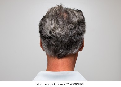 Mature man with salt and pepper hair starting to turn gray
