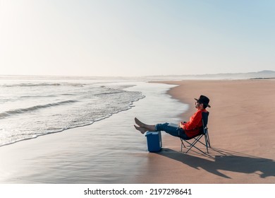 Mature Man Sitting Alone In A Chair On The Beach Relaxed 