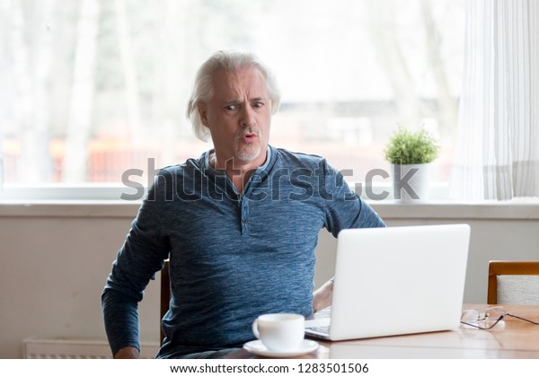 Mature Man Sitting On Chair Table Stock Photo Edit Now 1283501506