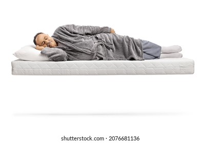 Mature man sleeping on a matress and floating isolated on white background - Powered by Shutterstock