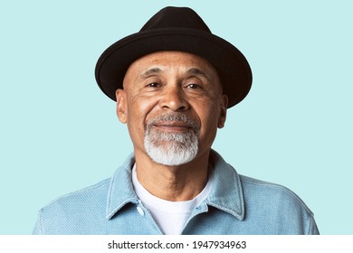 Mature man smiling face closeup portrait on blue background - Powered by Shutterstock