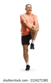 Mature Man In Sportswear Stretching His Leg Isolated On White Background