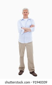 Mature Man Standing Up Against A White Background