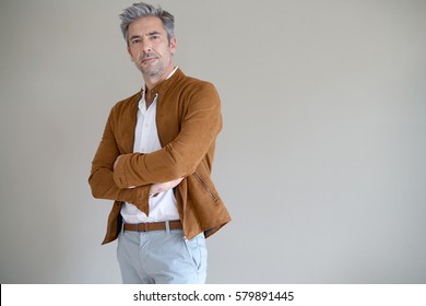 Mature Man Standing On Grey Background, Isolated