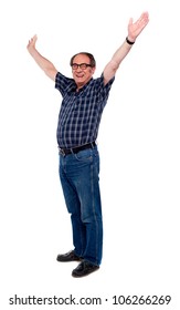 Mature Man Standing With Open Arms Against White