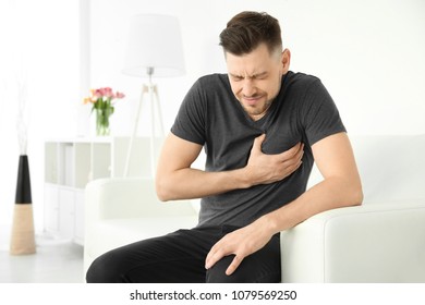 Mature Man Suffering From Heart Attack At Home