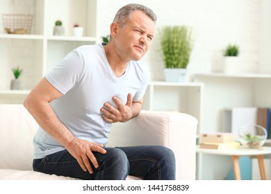 Mature Man Suffering Heart Attack Home Stock Photo (Edit Now) 1441758839