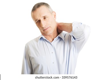 Mature man suffering from neck pain.