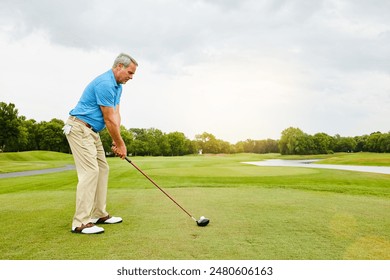 Mature, man and swinging on field for golf or ball for improve balance, coordination and retirement leisure with relax. Golfer, club and play on lawn for physical activity, mobility and outdoor sport