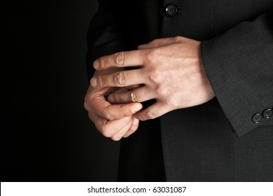 Mature Man Taking Off His Golden Wedding Ring, Close-up On Hands