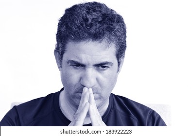 Mature man thinking with hands on his mouth looking down. close up on white background. real people. Concept photo of puzzled, confused, worried, problems, alone, thoughtful, worried, man (BW)
