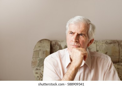 Mature Man Thinking And Looking Away