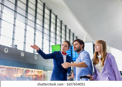 Mature Man Traveling With Her Sister While Asking For Assistance With The Airport Staff