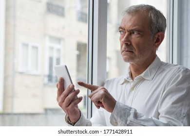 mature man using mobile phone