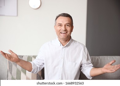 Mature Man Using Video Chat At Home