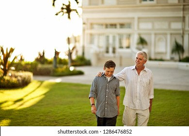 Mature Man Walking Arm Around Sons Stock Photo Edit Now