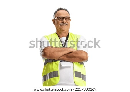 Mature man wearing a reflective vest and posing with crossed arms isolated on white background
