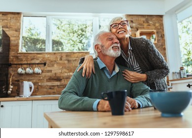 Mature man and woman enjoying morning at home