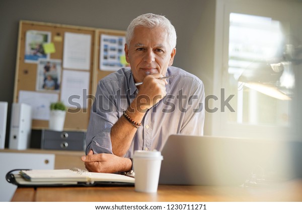 Mature Man Working Office Looking Camera Stock Photo Edit Now