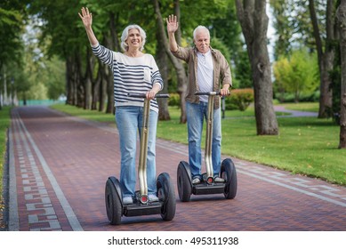 Mature Married Couple Having Fun On Segway