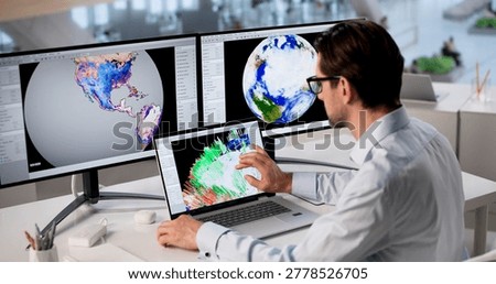 Mature Meteorologist Analyzes Computer Data To Predict Storm And Climate Changes.