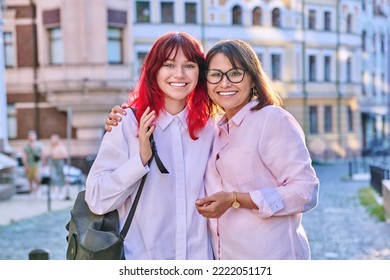 Mature Mom Hugging Her Teenage Daughter, Outdoor