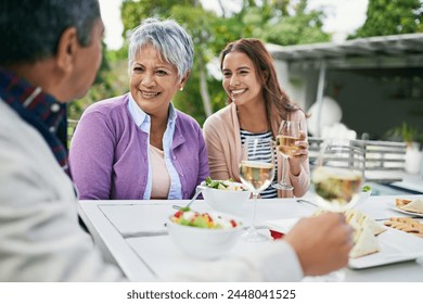 Mature mother, female daughter and smile with lunch on table and conversation with father for eating and enjoyment. Family, happy and food with wine or meal and bonding together on holiday in nature - Powered by Shutterstock