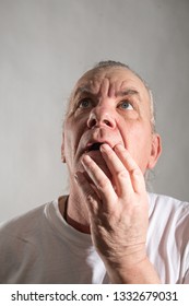 mature older man with shocked and horrified expression on face. hand to mouth. balding - Shutterstock ID 1332679031