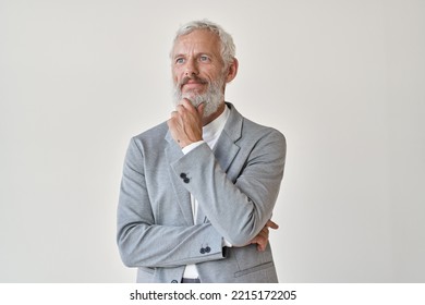 Mature Older Successful Business Man Investor, Thoughtful Middle Aged Senior Professional Businessman Holding Hand On Chin Looking Away Thinking Making Decision Standing Isolated On White Wall.