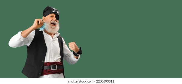 Mature Pirate With Alcohol On Green Background With Space For Text