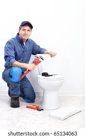 Mature Plumber Near A Flush Toilet