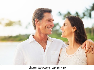 Mature Retired Couple Enjoying Tropical Sunset Beach Vacation