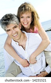 Mature Romantic Couple Of Baby Boomers Enjoying Outdoors