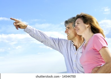 Mature Romantic Couple Of Baby Boomers Looking At The Sky