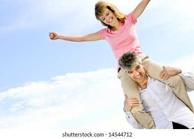 Mature Romantic Couple Of Baby Boomers Enjoying Outdoors