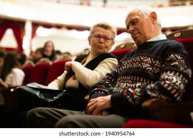 Mature senior sleeping at ballet performance in theater hall - Powered by Shutterstock