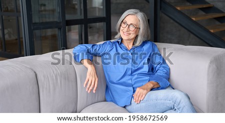 Similar – Image, Stock Photo Woman resting in a white car pulling her feet out the window.