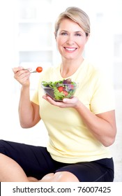 Mature Smiling Woman  Eating Salad,  Fruits And Vegetables.