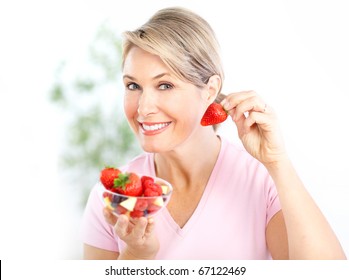 Mature Smiling Woman  Eating Strawberries