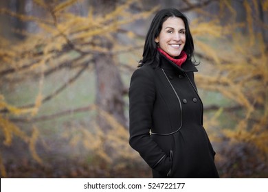 Mature Spanish Woman Smiling At The Camera. Outside.