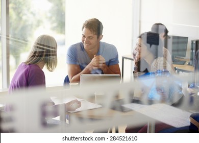 Mature Students Working In College Breakout Area