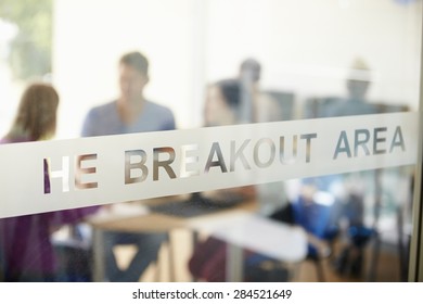 Mature Students Working In College Breakout Area