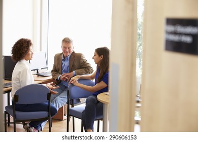 Mature Students Working In College Breakout Area