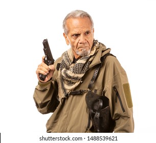 Mature Survivalist With A Gun Drawn, Looking To The Right.